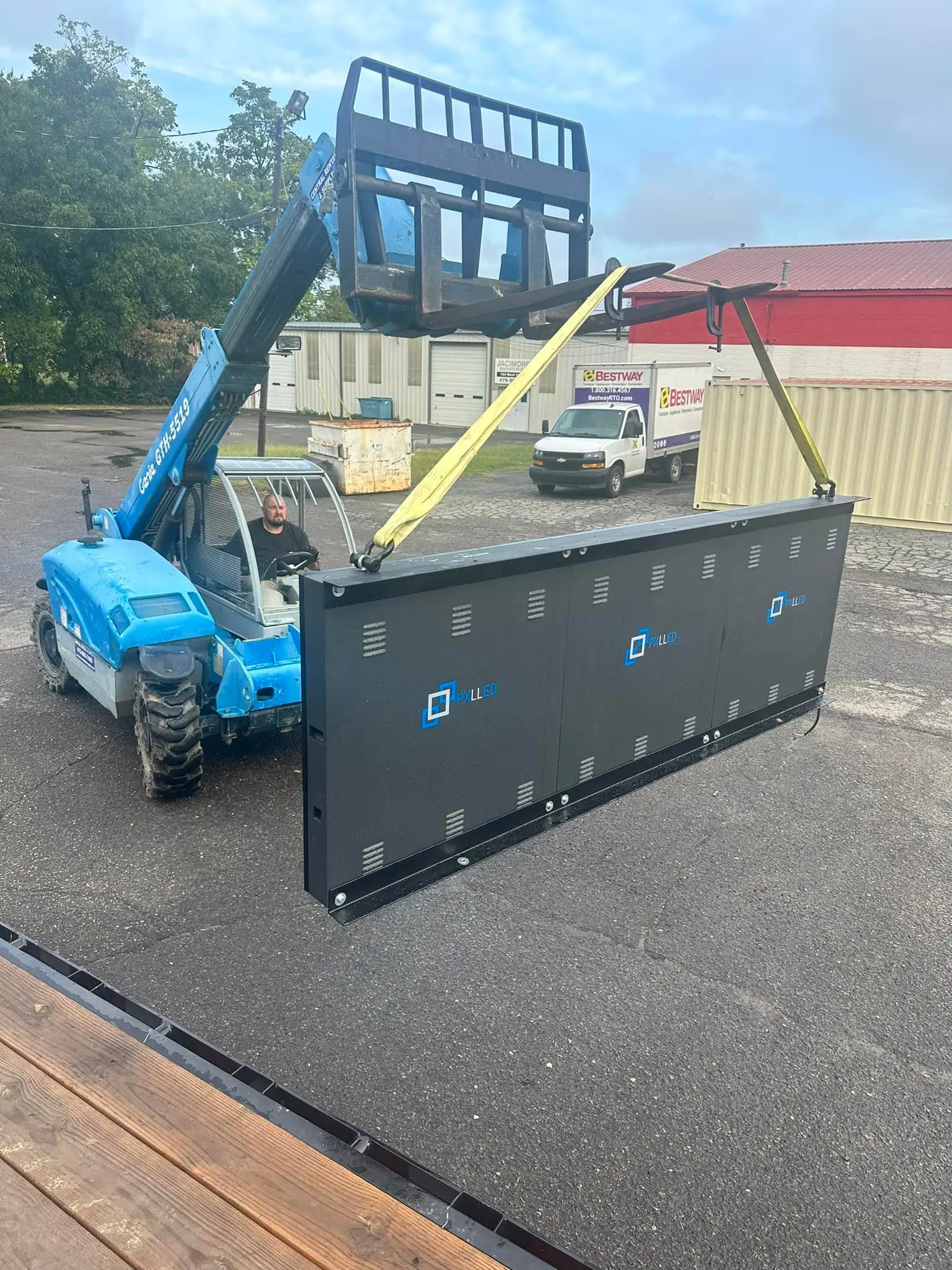 Telehandler required to lift a legacy closed-cabinet LED sign